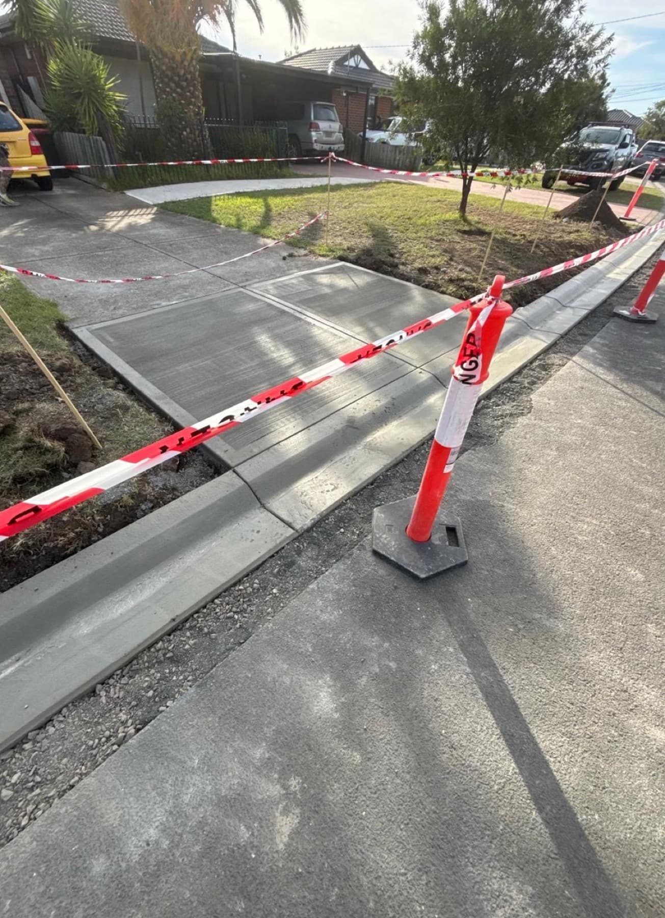 Fresh crossing slab and new kerb along the street