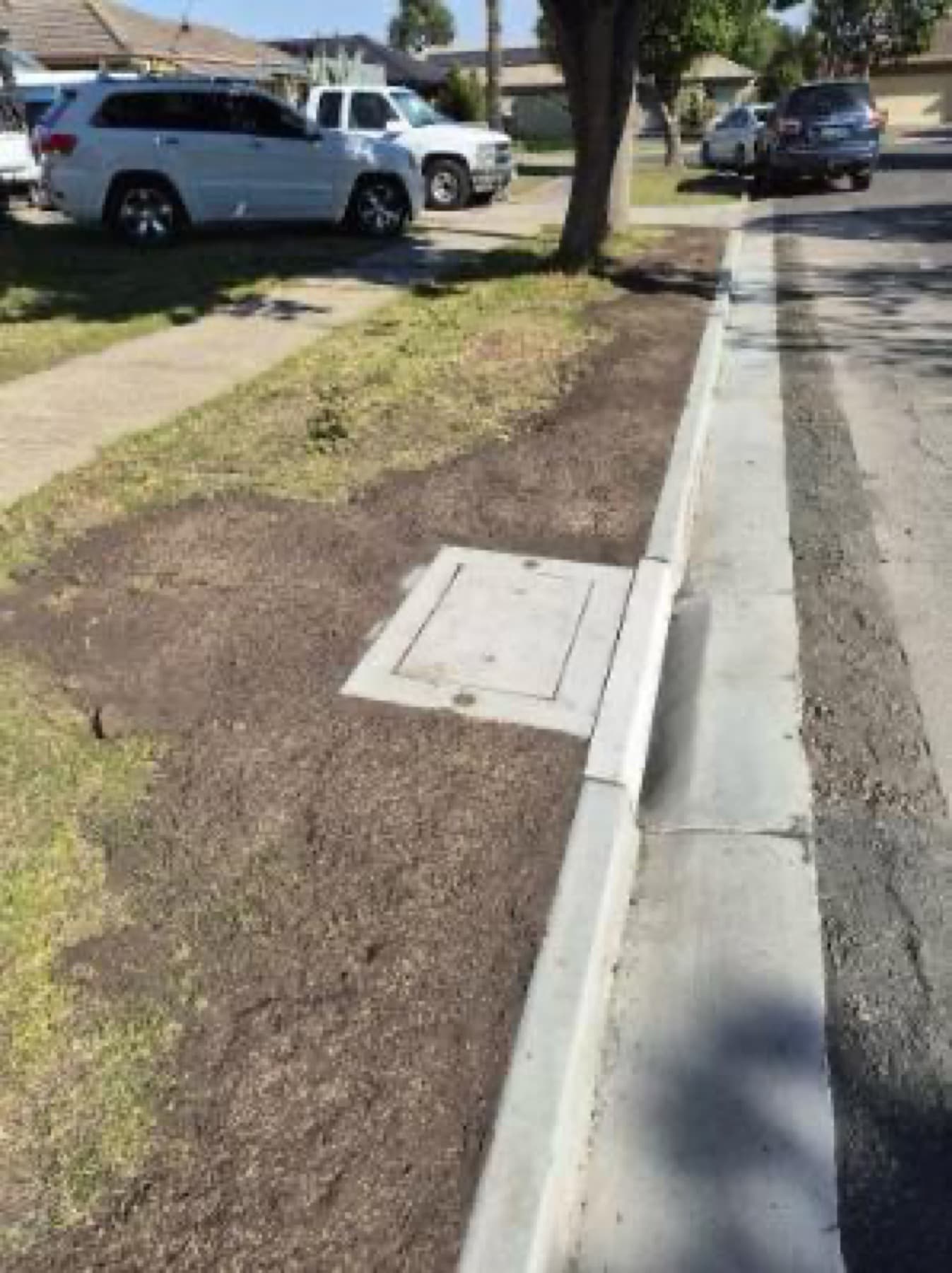 New kerb and channel with service pit beside the road