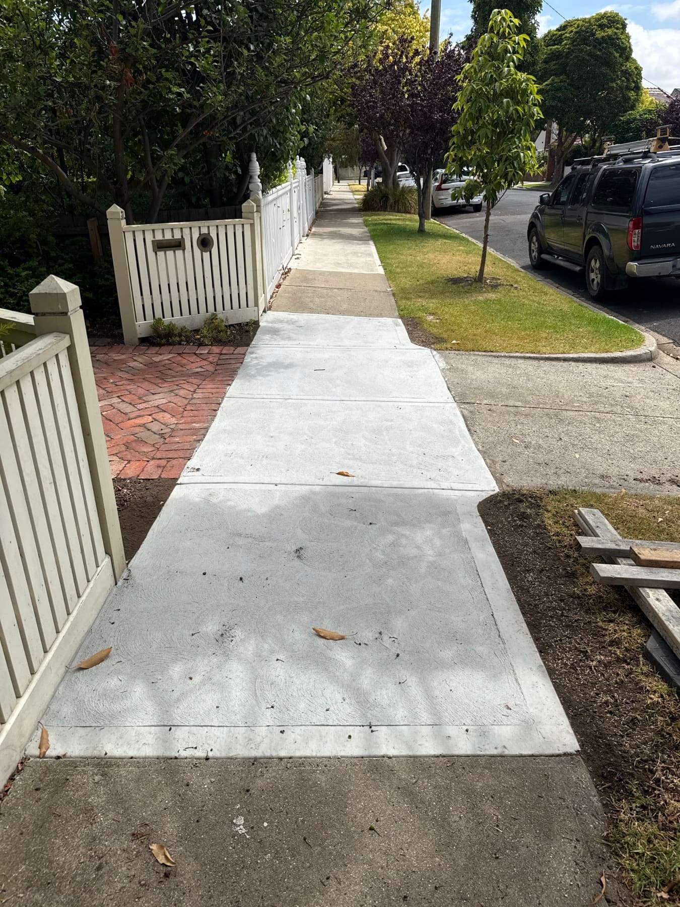 Crossing to brick driveway